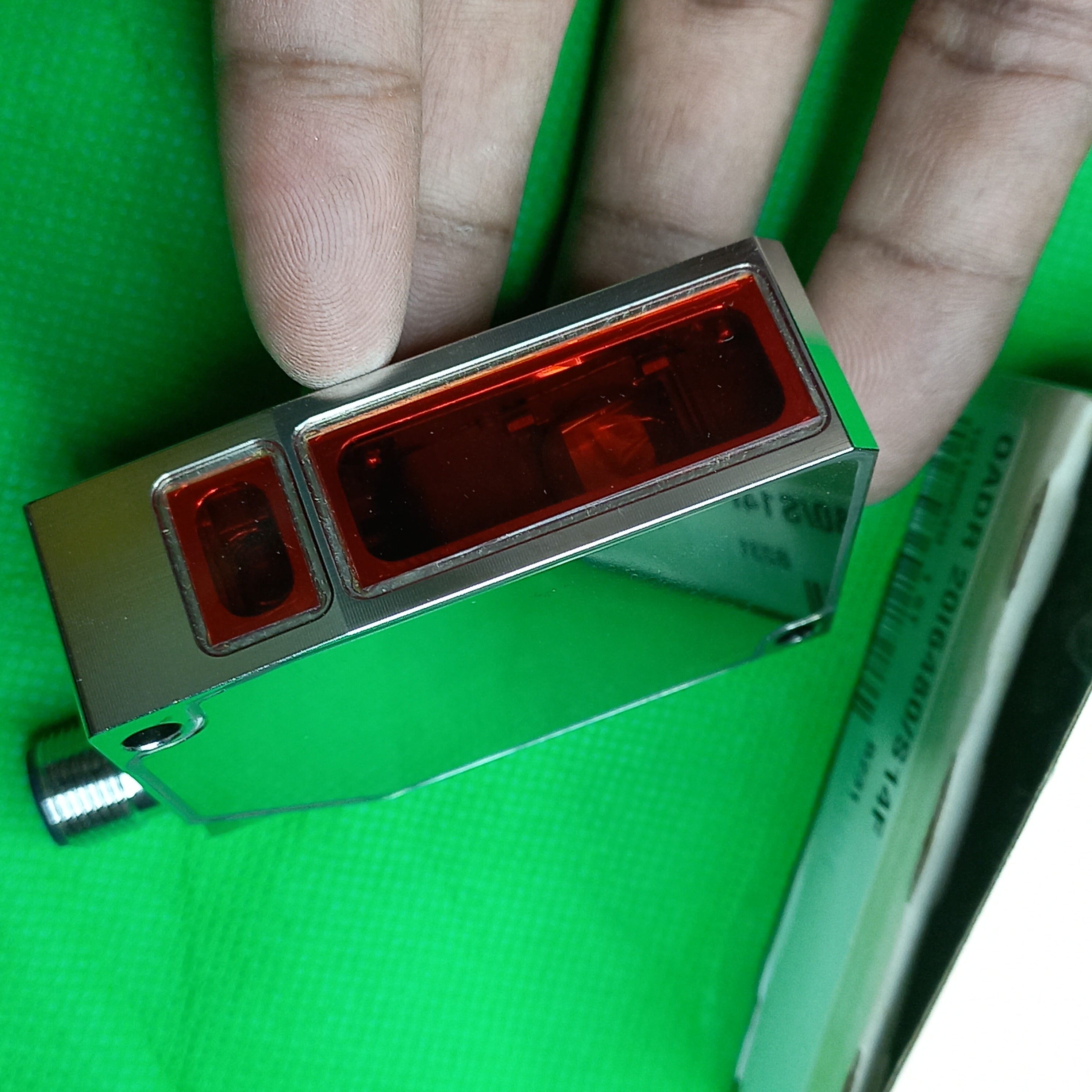 Photo of Laser Sensing face of Baumer Distance sensor 0ADR20 (Laser, variable sensing range) OADR20i6480/S14F