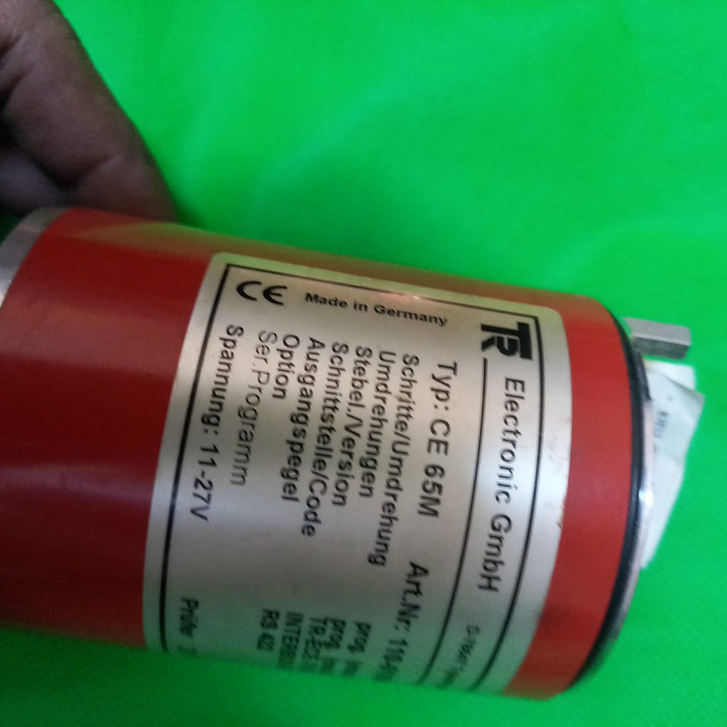 Main specification sticker half visible because of camera angle next to scomplete specs sticker for TR Electronic CE 65 M Art. Number; 110 01654 Interbus - S/Binar | CE 65M | 4096Prog. x 4096(Progr.)