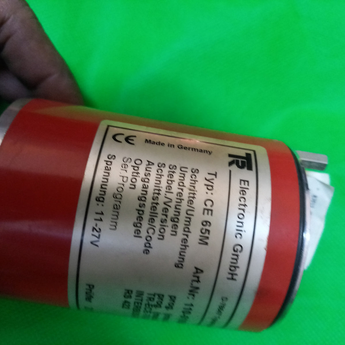 Main specification sticker half visible because of camera angle next to scomplete specs sticker for TR Electronic CE 65 M Art. Number; 110 01654 Interbus - S/Binar | CE 65M | 4096Prog. x 4096(Progr.)