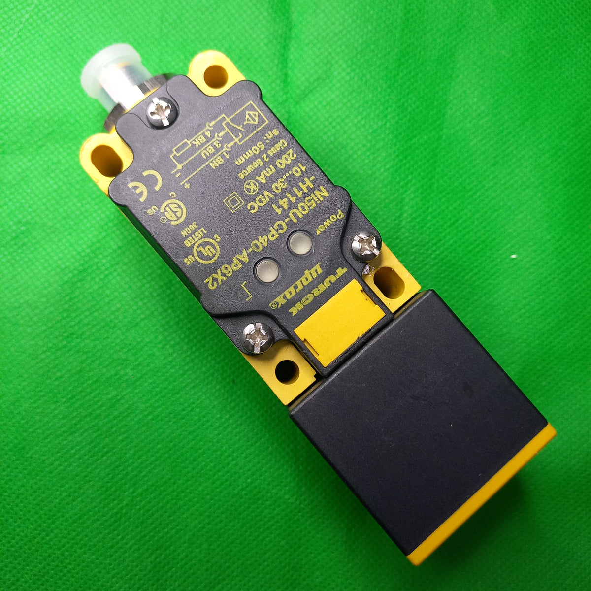Front view with specificaiton sticker details  NI50U-CP40-AP6X2-H1141; Rectangular; Height 40mm; DC 3-wire, 10…30 VDC; NO contact, PNP output; M12 x 1 male connector

EAN	4047101080117