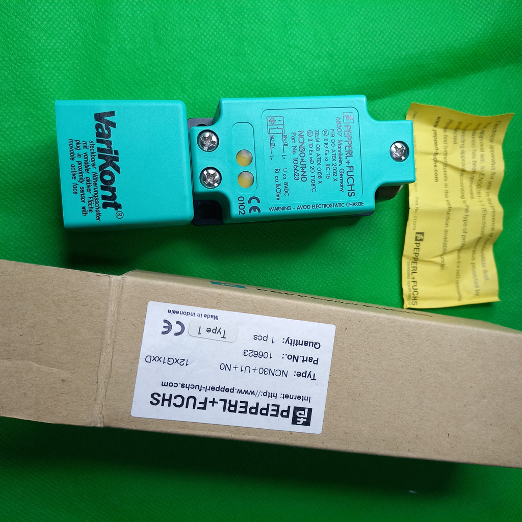 sensor side by side with box photo NCN30+U1+N0, 106623, Normally Closed, Output type: NAMUR, Rated operating distance 30mm, Non Flush, 40x40x118