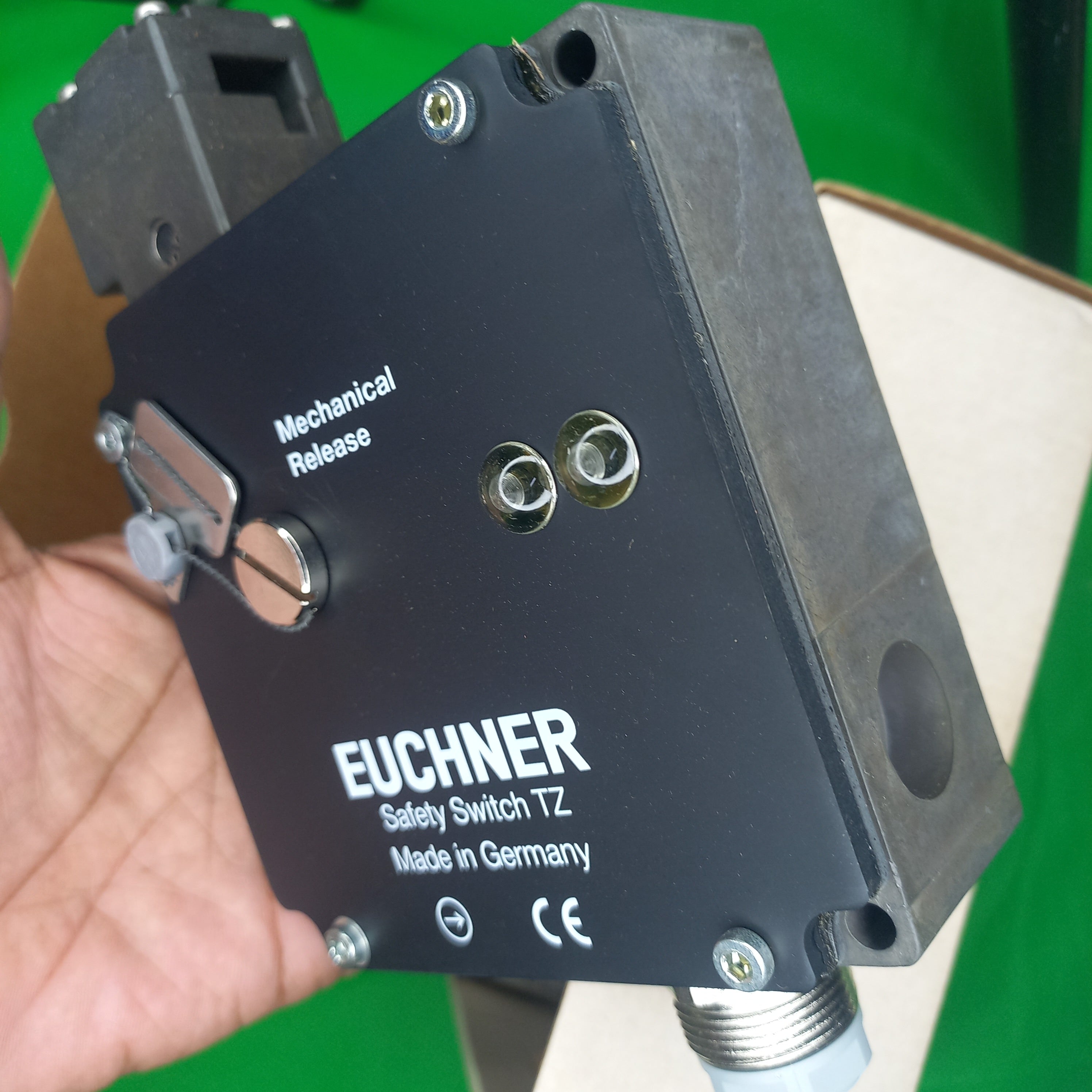 Full isometric view 3 sides of safety switch with mechanical release mechanism showing Videwo featuring unoboxing of TZ1LE220SR6 Euchner 46504