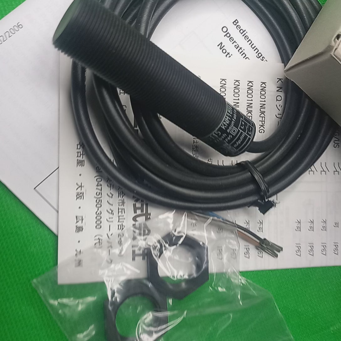 SEnsor Capacitive sensor KN5115 KNM18NUKFPKG With Front face visible, and the specification sticker.